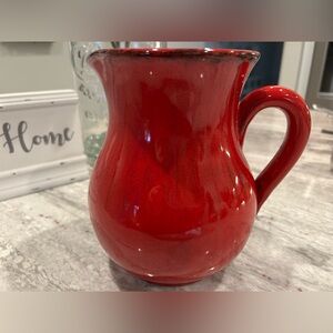Red Ceramic Pitcher With Black Rim and Shading